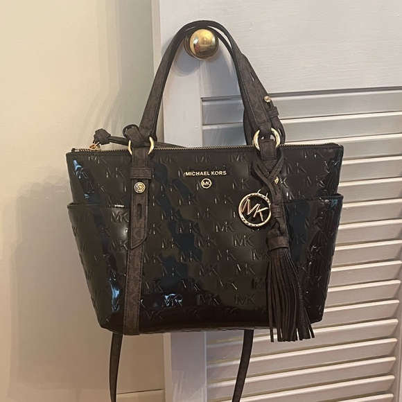 Michael Kors Glossy Black Shoulder Bag with Iconic MK Charm and brown handles. - Picture 1 of 8